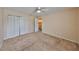 Spacious bedroom featuring carpet, a closet, ceiling fan, and neutral paint at 10730 Shady Preserve Dr, Riverview, FL 33579