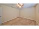 A bedroom featuring carpet, a ceiling fan, and neutral paint with a window view at 10730 Shady Preserve Dr, Riverview, FL 33579