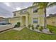 Charming two-story home boasts a well-manicured lawn, a two-car garage, and a welcoming entrance at 10730 Shady Preserve Dr, Riverview, FL 33579