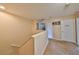 Upstairs hallway with carpet and natural light, leading to bedrooms and bathroom at 10730 Shady Preserve Dr, Riverview, FL 33579