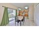 Eat-in kitchen features an island and sliding doors to the backyard at 10730 Shady Preserve Dr, Riverview, FL 33579