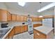 Bright kitchen featuring ample cabinet space, a practical island, and modern appliances at 10730 Shady Preserve Dr, Riverview, FL 33579