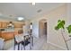 View of kitchen with stainless steel appliances and tile flooring, connected to dining area at 10730 Shady Preserve Dr, Riverview, FL 33579