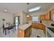 Eat-in kitchen features an island and sliding doors to the backyard at 10730 Shady Preserve Dr, Riverview, FL 33579