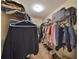 Walk-in closet with clothing and storage, providing ample space at 10730 Shady Preserve Dr, Riverview, FL 33579