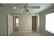 Bedroom with standard closet doors and a ceiling fan, neutral walls, and carpet at 10811 Brickside Ct, Riverview, FL 33579