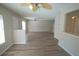 Spacious living room showcasing new hardwood floors and neutral color palette, perfect for relaxation at 10811 Brickside Ct, Riverview, FL 33579