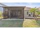 Great backyard space features a screened lanai and mature landscaping at 11421 Quiet Forest Dr, Tampa, FL 33635
