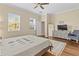 Inviting bedroom with natural light, a comfortable bed, and a relaxing atmosphere at 11421 Quiet Forest Dr, Tampa, FL 33635