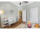 Comfortable bedroom featuring a toddler bed, ceiling fan, and plenty of natural light at 11421 Quiet Forest Dr, Tampa, FL 33635