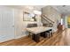 Elegant dining room featuring a marble table, modern chandelier, and stylish artwork at 11421 Quiet Forest Dr, Tampa, FL 33635