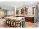 Spacious kitchen with granite countertops, stainless steel appliances, and dark wood cabinets at 11421 Quiet Forest Dr, Tampa, FL 33635