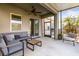 Inviting screened lanai with comfortable seating and ceiling fan at 11421 Quiet Forest Dr, Tampa, FL 33635