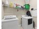 Functional laundry room equipped with modern appliances and ample storage space at 11421 Quiet Forest Dr, Tampa, FL 33635