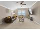 Large living room with ceiling fan, comfortable seating, television, and neutral color palette at 11421 Quiet Forest Dr, Tampa, FL 33635