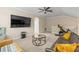 Upstairs living room features neutral colors, ceiling fan, and plenty of open space at 11421 Quiet Forest Dr, Tampa, FL 33635