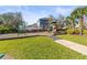 A vibrant community playground featuring swings, slides, and a safe play surface within a friendly neighborhood at 11421 Quiet Forest Dr, Tampa, FL 33635