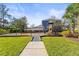 A community playground with slides, swings, and a cushioned ground surface, perfect for Gathering fun at 11421 Quiet Forest Dr, Tampa, FL 33635