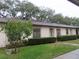 Charming single story home with mature landscaping, trimmed bushes, and mulch at 11511 113Th St # 36B, Largo, FL 33778