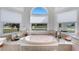 Bright bathroom featuring a soaking tub, and large windows, creating a relaxing spa-like atmosphere at 14247 Spanish Wells Dr, Hudson, FL 34667
