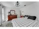 Spacious bedroom with decorative ceiling light, and a large dresser at 14247 Spanish Wells Dr, Hudson, FL 34667