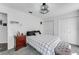Spacious bedroom with decorative ceiling light, two closets, and carpet at 14247 Spanish Wells Dr, Hudson, FL 34667
