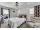 Bedroom featuring ceiling light, two windows, carpet, and a chair at 14247 Spanish Wells Dr, Hudson, FL 34667