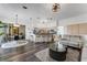 Open-concept living space connects the living room and kitchen with a breakfast bar and modern appliances at 14247 Spanish Wells Dr, Hudson, FL 34667