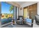 Office features a comfortable chair, slider doors offering a view, and modern decor at 14247 Spanish Wells Dr, Hudson, FL 34667