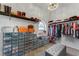 Well-organized walk-in closet with ample storage, shelves, and hanging space for clothes and accessories at 14247 Spanish Wells Dr, Hudson, FL 34667