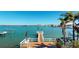 Scenic waterfront view from the private dock, showcasing the calm bay and skyline in the distance at 15417 2Nd E St, Madeira Beach, FL 33708