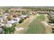 Aerial view of the golf course and surrounding homes in the community at 18111 Diamond Cove Ct, Tampa, FL 33647