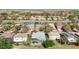 Community aerial view featuring houses, a pond, and golf course in a picturesque neighborhood at 18111 Diamond Cove Ct, Tampa, FL 33647