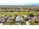 Stunning aerial view of a home nestled within a golf course community, surrounded by lush greenery and water features at 18111 Diamond Cove Ct, Tampa, FL 33647