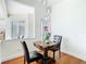 Breakfast nook with a beautiful table, chairs, and a view to the outside at 18111 Diamond Cove Ct, Tampa, FL 33647