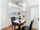 Breakfast nook with a beautiful table, chairs, and a view to the outside at 18111 Diamond Cove Ct, Tampa, FL 33647