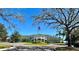 Clubhouse with a roundabout and an American flag at 18111 Diamond Cove Ct, Tampa, FL 33647