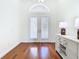 Bright foyer featuring hardwood floors, double door entry and decorative furnishings at 18111 Diamond Cove Ct, Tampa, FL 33647