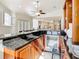 Open-concept kitchen boasts granite counters, wine fridge, and seamless transition to living spaces at 18111 Diamond Cove Ct, Tampa, FL 33647