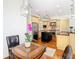 Open-concept kitchen featuring a central island, stainless steel appliances, and custom cabinetry at 18111 Diamond Cove Ct, Tampa, FL 33647
