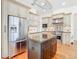 Spacious kitchen with a large refrigerator, kitchen island and stainless steel oven at 18111 Diamond Cove Ct, Tampa, FL 33647