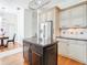 Gourmet kitchen featuring modern appliances, granite countertops and a center island at 18111 Diamond Cove Ct, Tampa, FL 33647