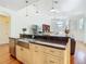 Kitchen island with stainless steel sink and dark granite countertops at 18111 Diamond Cove Ct, Tampa, FL 33647