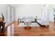 Spacious living room with hardwood floors, neutral paint and comfortable furnishings at 18111 Diamond Cove Ct, Tampa, FL 33647