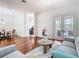 Open-concept living room with hardwood floors, neutral colors and easy access to the patio at 18111 Diamond Cove Ct, Tampa, FL 33647