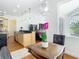 Living Space near kitchen and breakfast nook with hardwood floors and white walls at 18111 Diamond Cove Ct, Tampa, FL 33647