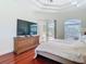 Spacious main bedroom has tray ceilings and lanai access at 18111 Diamond Cove Ct, Tampa, FL 33647