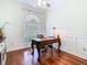 Bright office featuring hardwood floors, a ceiling fan and traditional wood desk facing the window at 18111 Diamond Cove Ct, Tampa, FL 33647