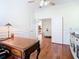 Charming home office featuring hardwood floors, wainscoting, and ample natural light at 18111 Diamond Cove Ct, Tampa, FL 33647