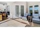 Covered patio featuring neutral furniture, stone floors, and french doors at 18111 Diamond Cove Ct, Tampa, FL 33647